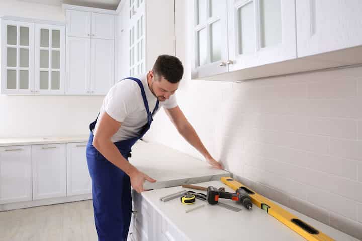 A contractor completing a kitchen remodel in Feasterville-Trevose, PA.